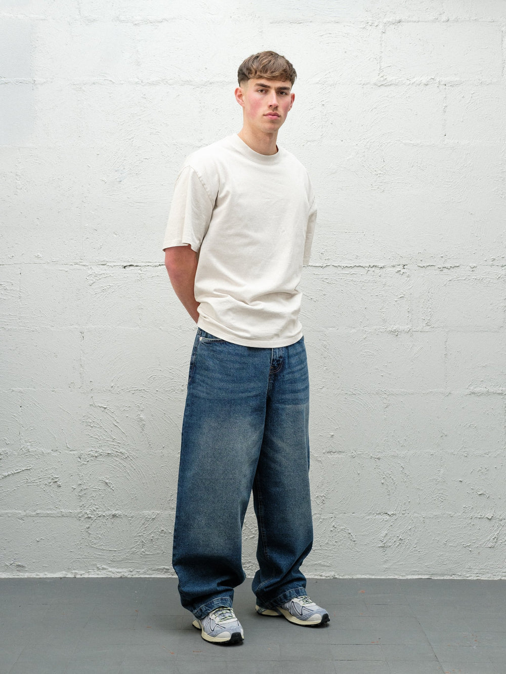Denim Pant | Frost Front on paired with cream t-shirt and solomons. 