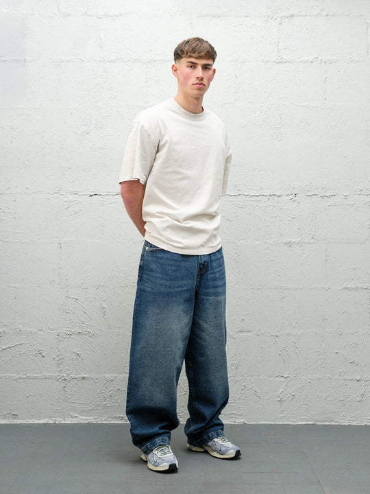 Denim Pant | Frost Front on paired with cream t-shirt and solomons. 