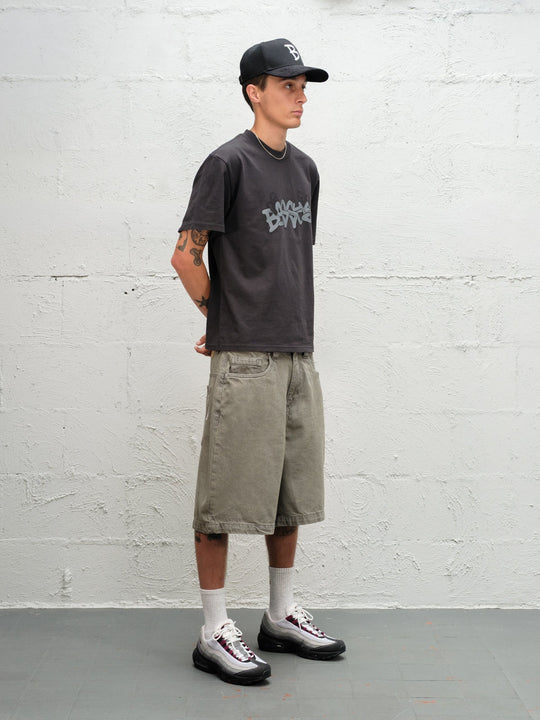 Model wearing Grab Tee faded black with Denim Short | Sage Baggys.uk