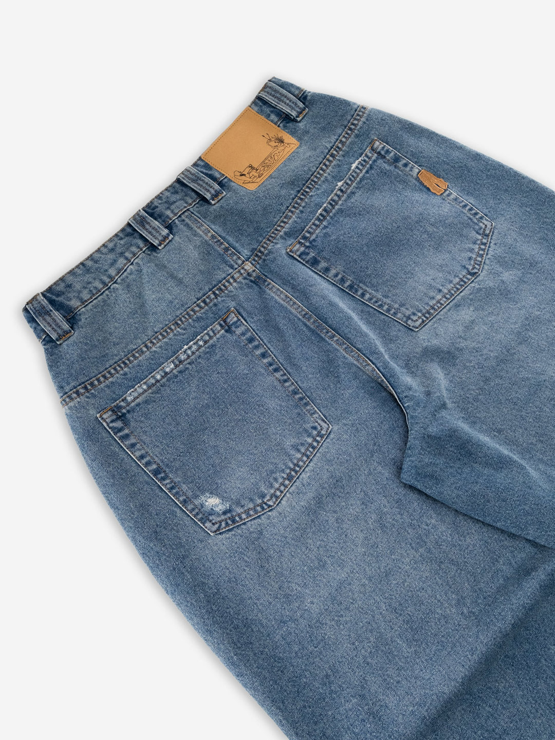 Baggys Denim Pant Fray — rear hem close-up flatlay, light blue wash