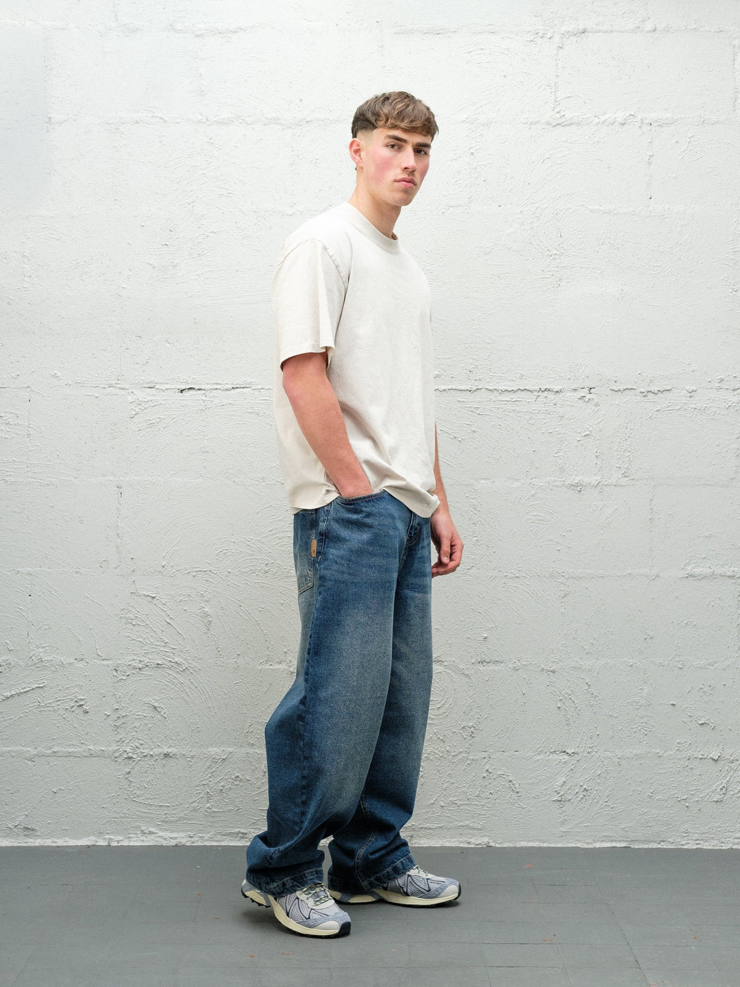 Denim Pant | Frost side on paired with cream t-shirt and solomons. 