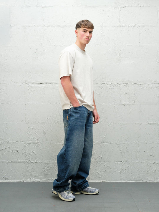 Denim Pant | Frost side on paired with cream t-shirt and solomons. 