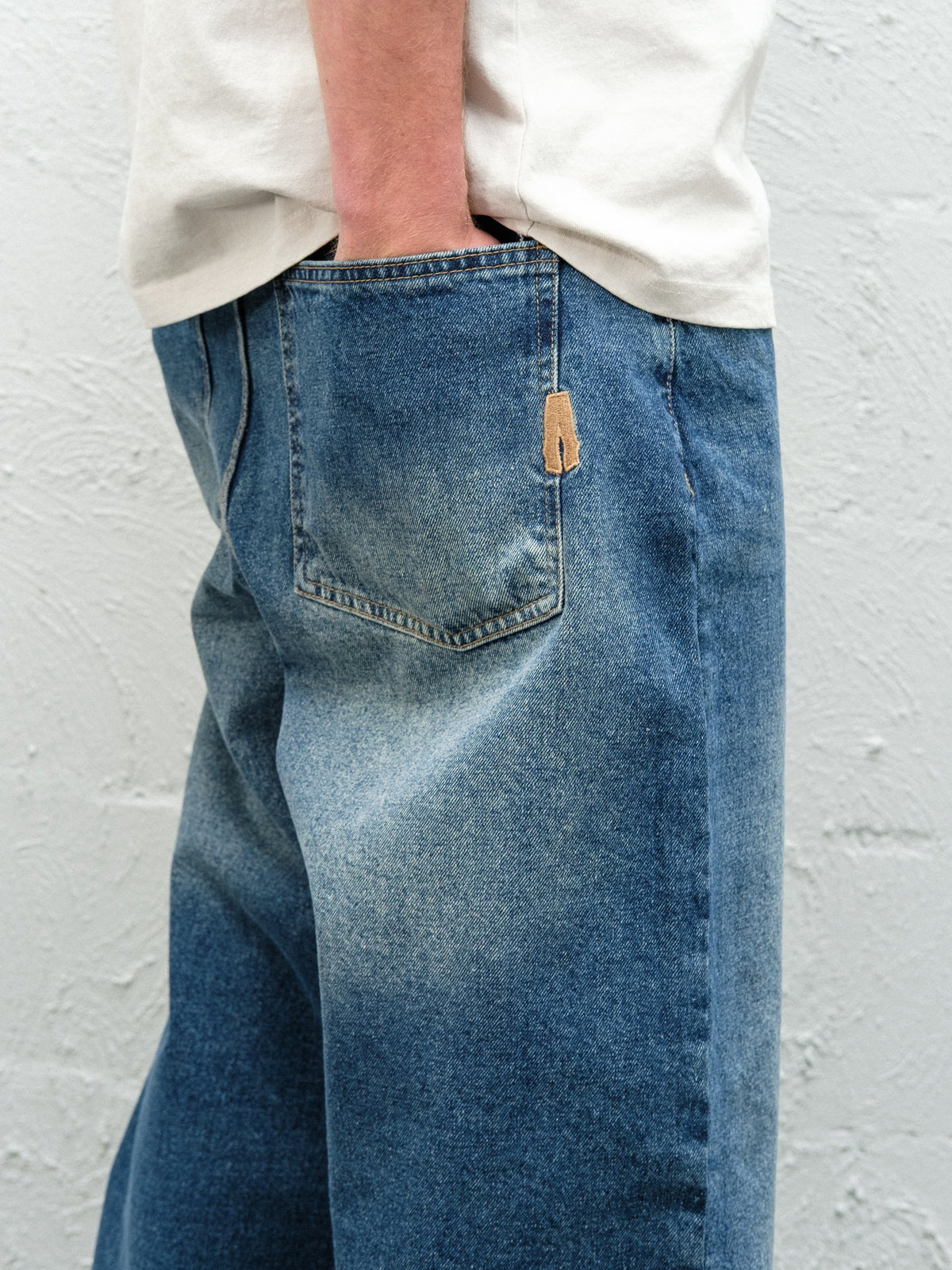 Denim Pant | Frost Close up on the rear back pocket and embroidery 