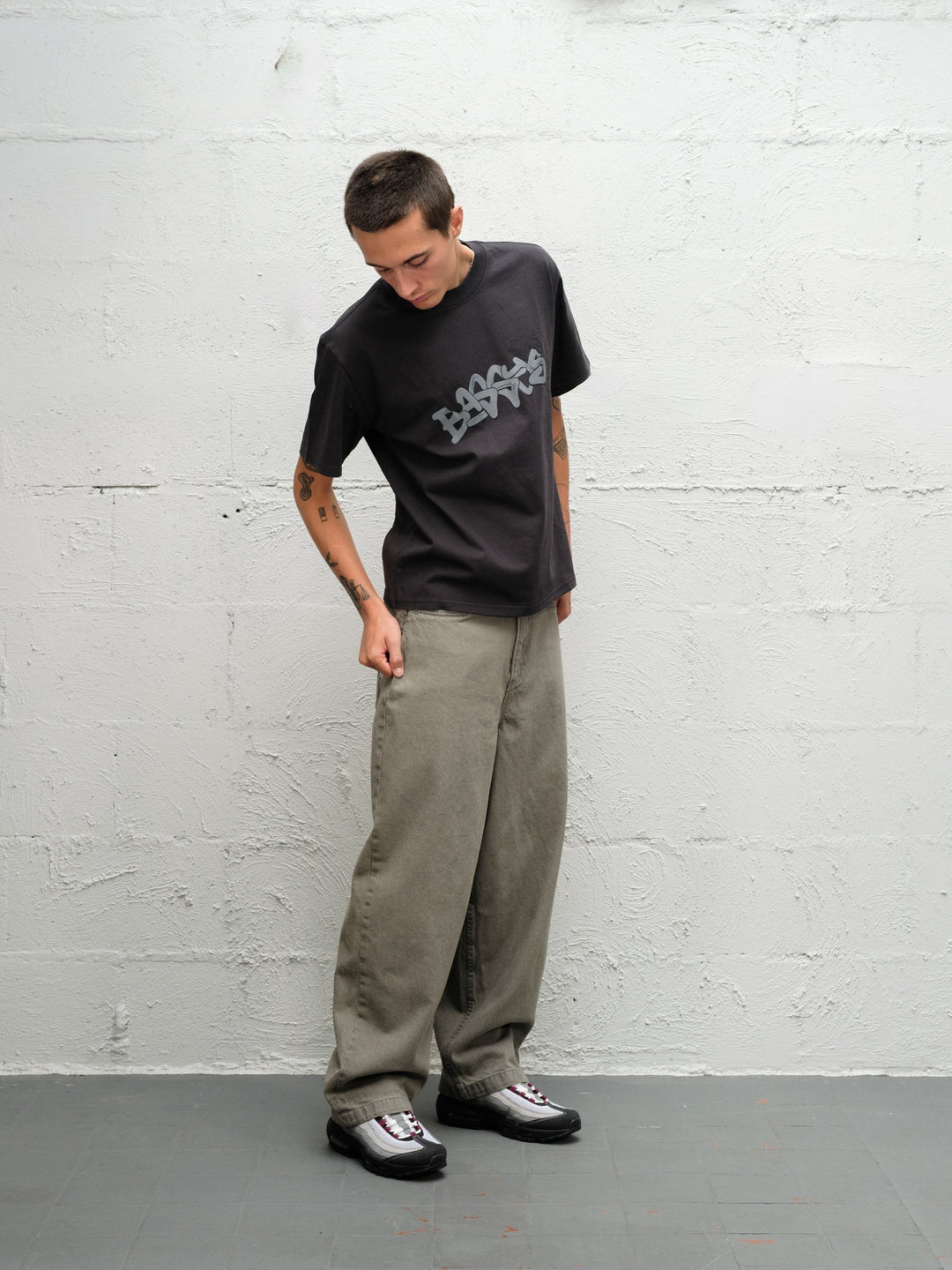 Model wearing Grab tee faded black with DENIM PANT | SAGE 