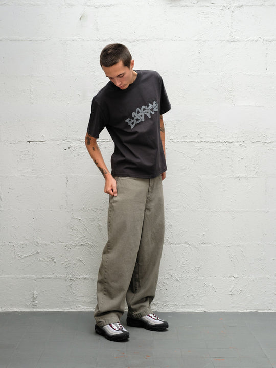 Model wearing Grab tee faded black with DENIM PANT | SAGE 
