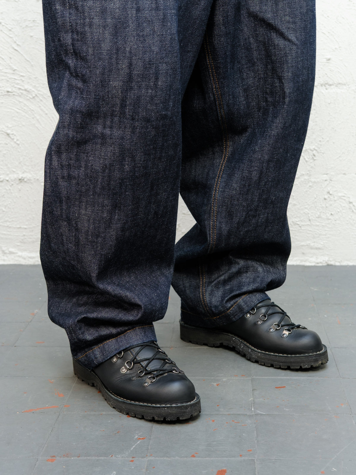 Denim Pant | Indigo Raw Selvedge Close up on sittin on danner boots