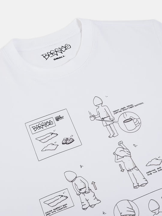 White t-shirt with black line art illustrations and text on a white background