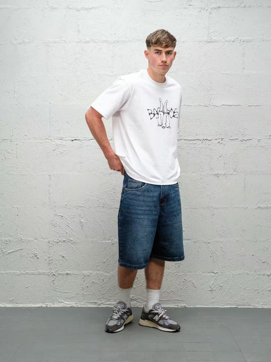 Person wearing blue baggy denim dove jean shorts, made by Baggys.uk
