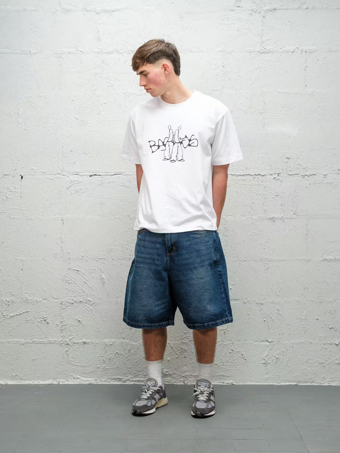 Person wearing blue baggy denim dove jean shorts, made by Baggys.uk