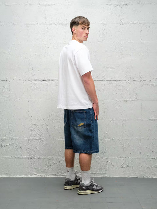 Person wearing blue baggy denim dove jean shorts, made by Baggys.uk