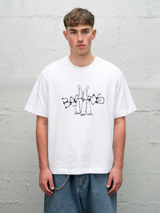 Person wearing white screen printed graphic t-shirt
