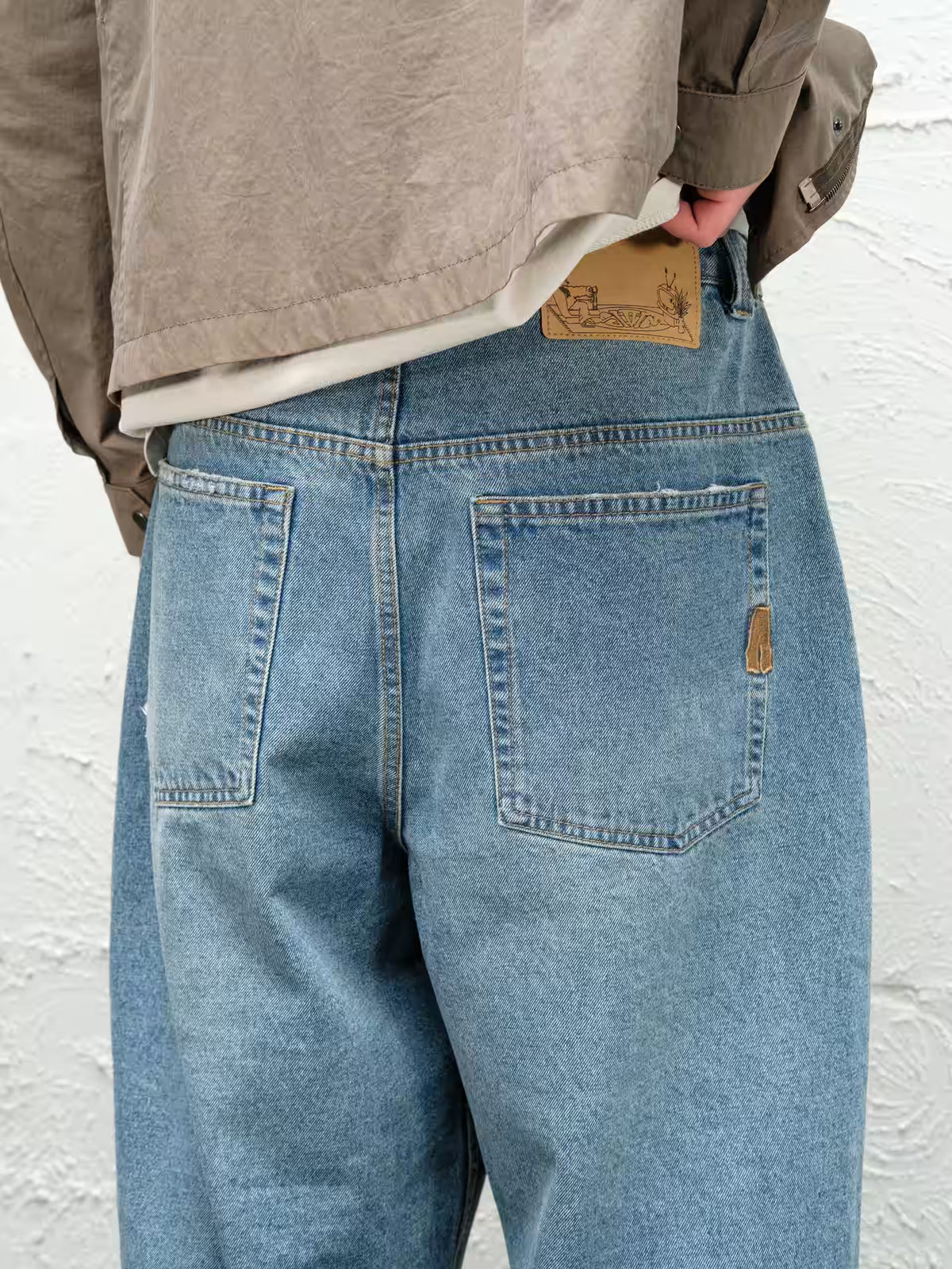 Fray Blue baggy denim pant, close up of back belt patch