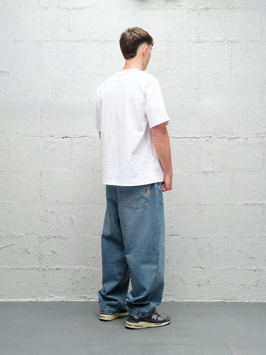 Model wearing Baggys Denim Pant Fray — light blue baggy jeans, rear view