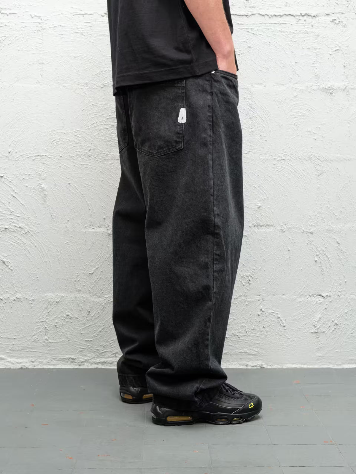 Pitch denim pant low half from side