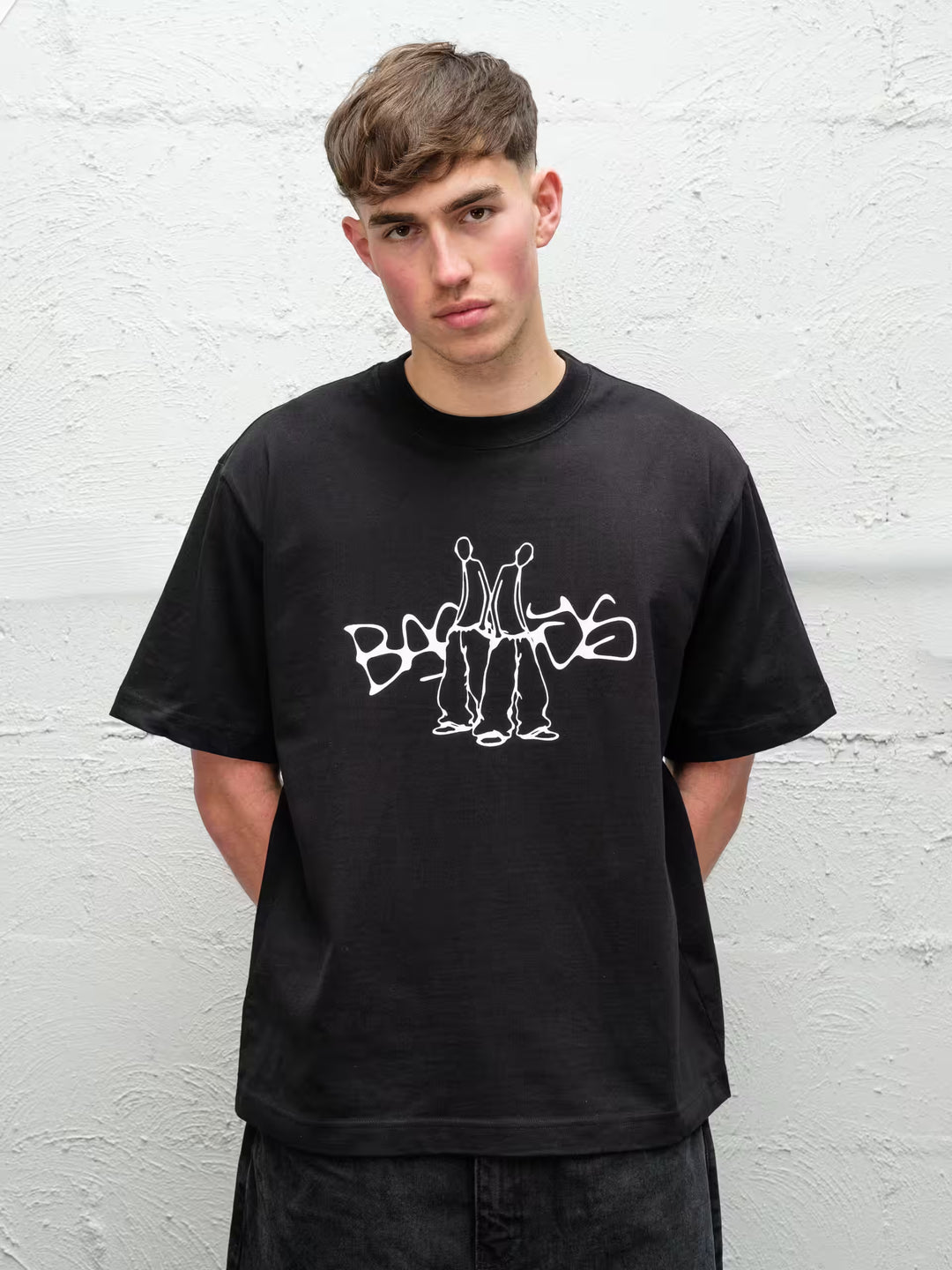 Person wearing black screen printed duo tee