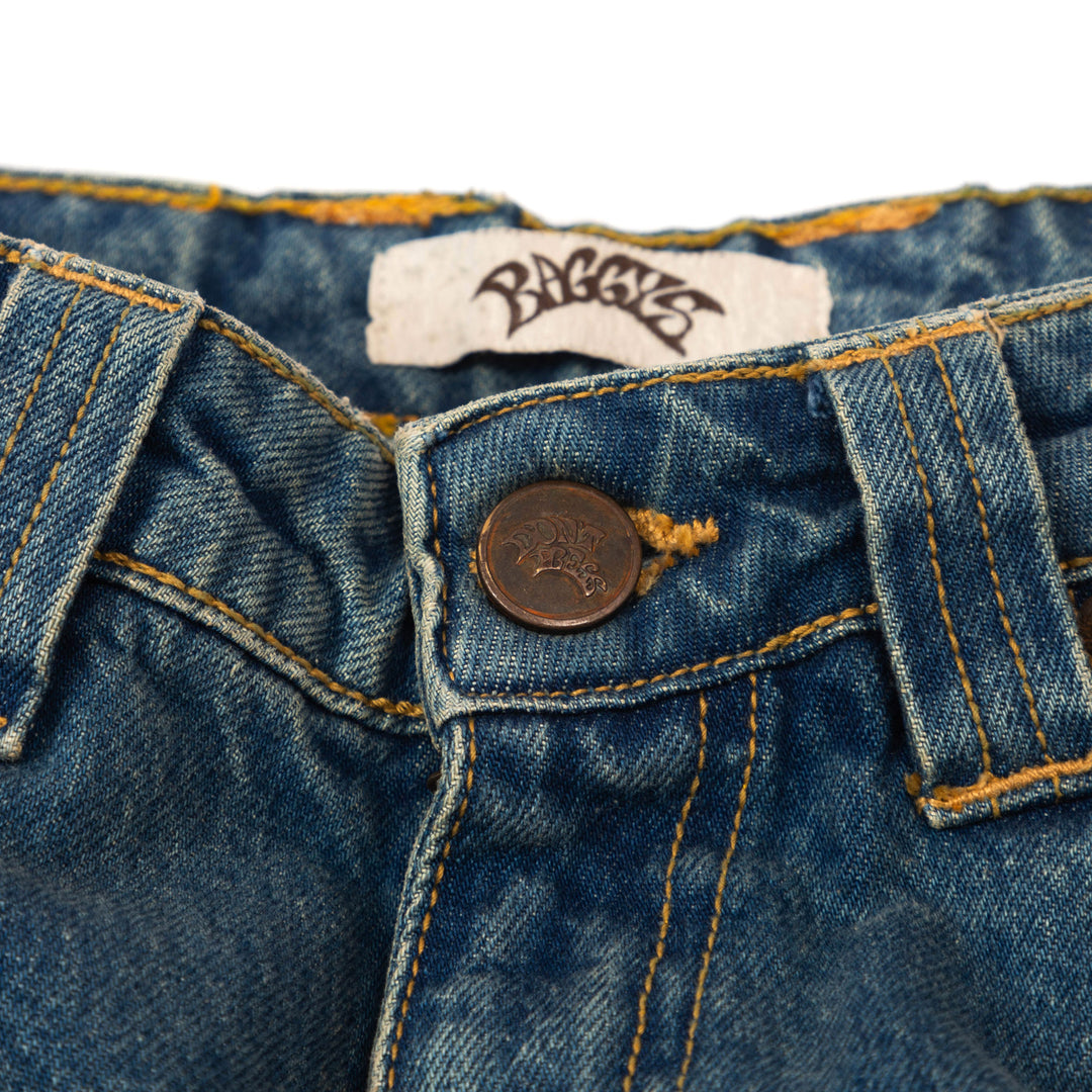 the Baggy Blue custom rust metal button and close up stitching