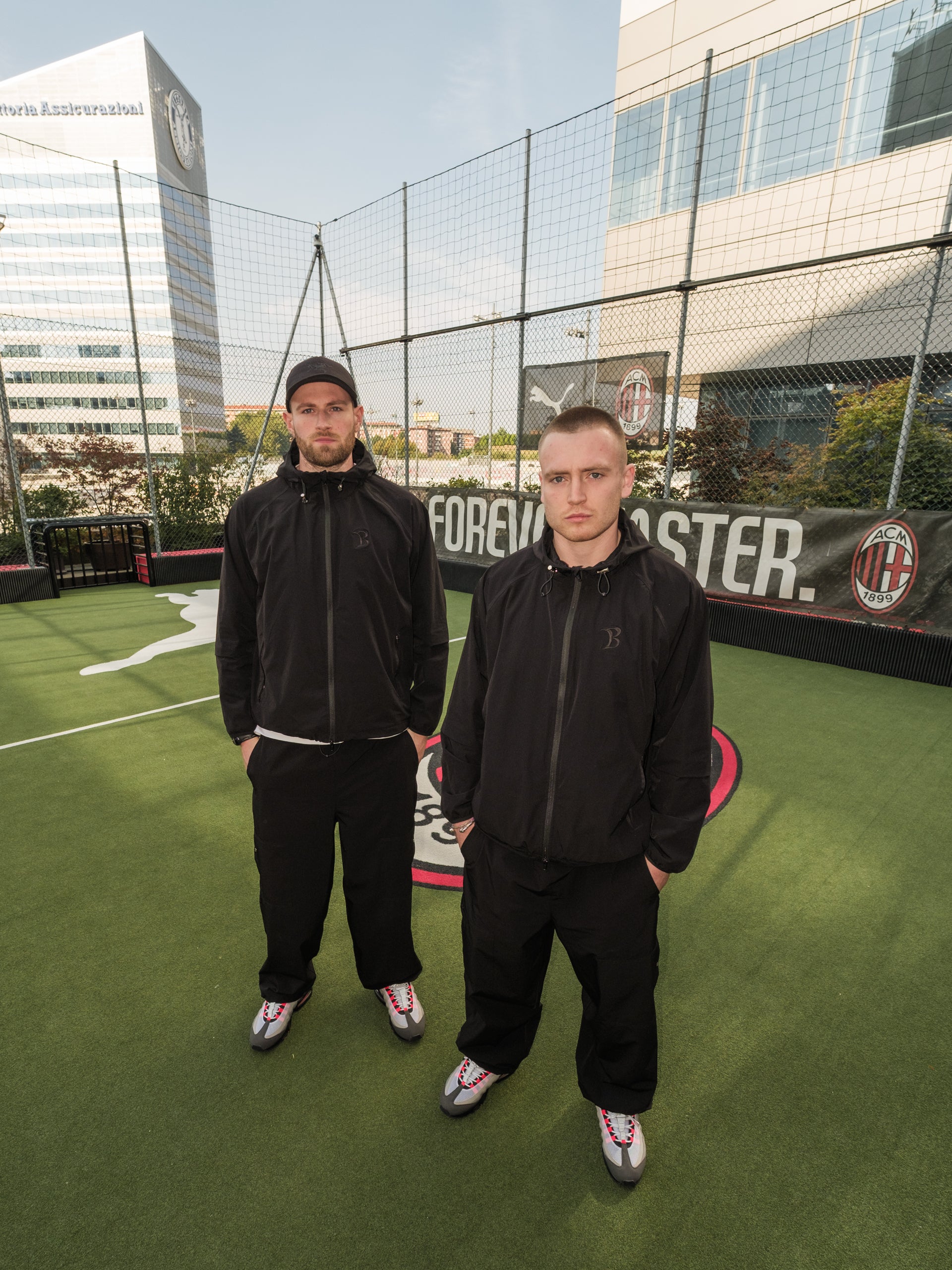 Two men wearing Baggy Vanta Black Tracksuit in Milan