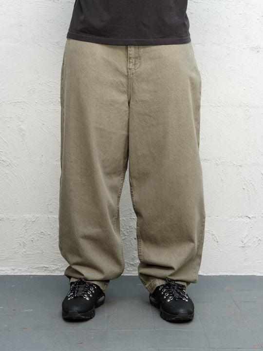 Model wearing Runnin man tee faded black with DENIM PANT | SAGE Baggys.uk