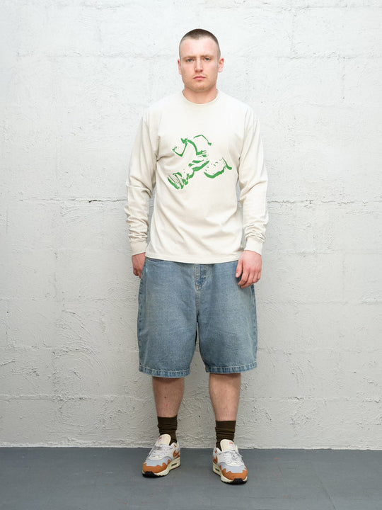 Model wearing Runnin' Man Tee in Bone and Denim Short | Fray 