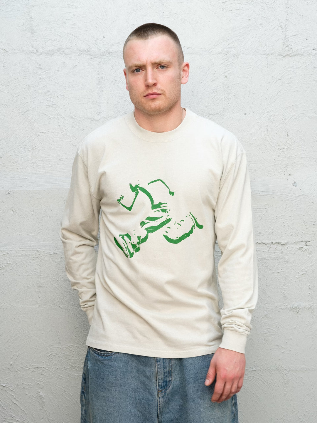 Model wearing Baggys Runnin' Man Tee in Faded Bone, front view