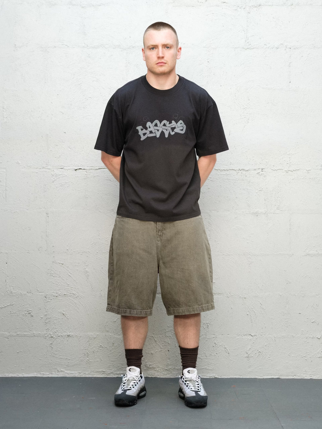 Model wearing Grab Tee faded black with Denim Short | Sage Baggys.uk