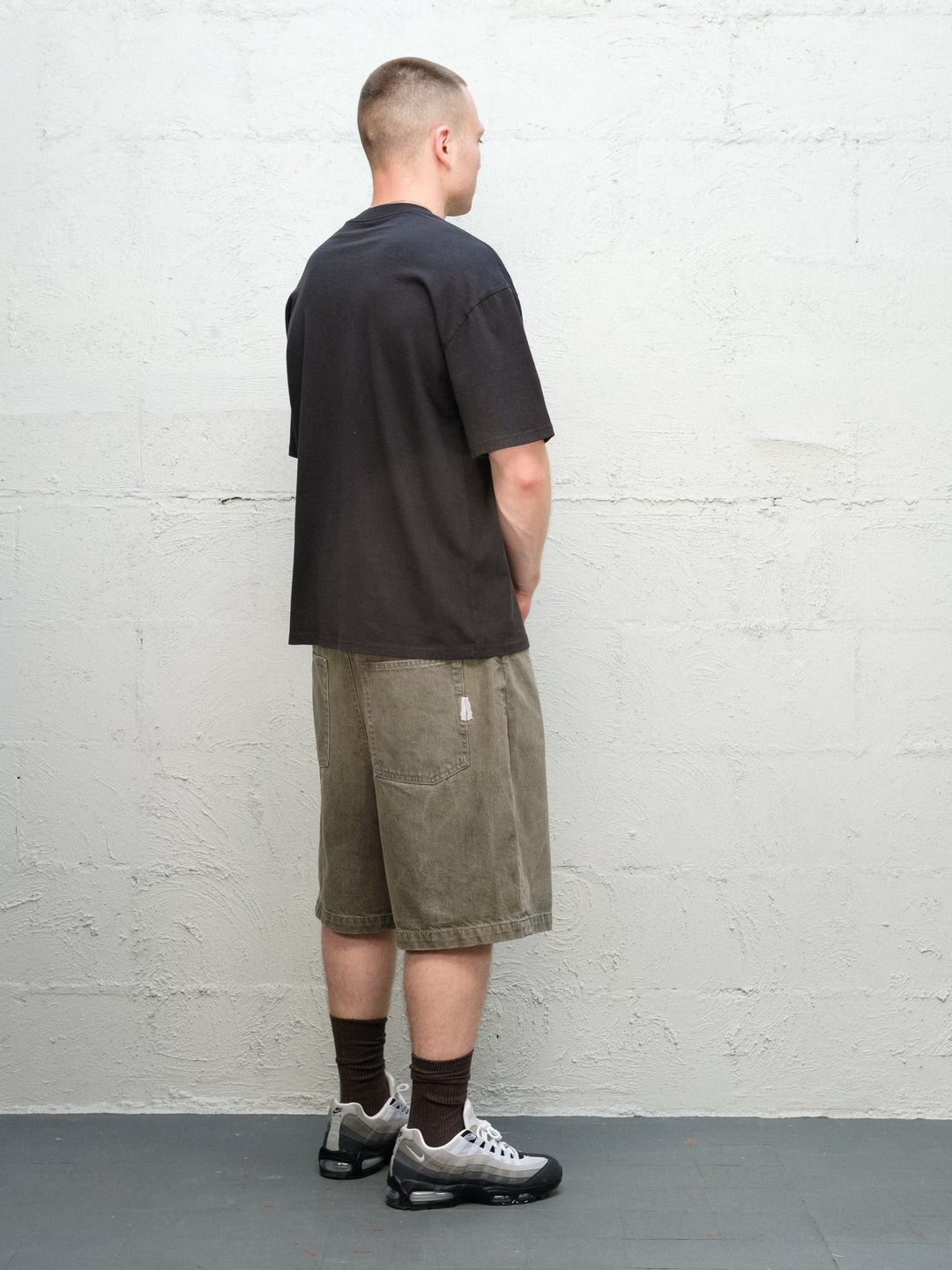 Model wearing Grab Tee faded black with Denim Short | Sage Baggys.uk