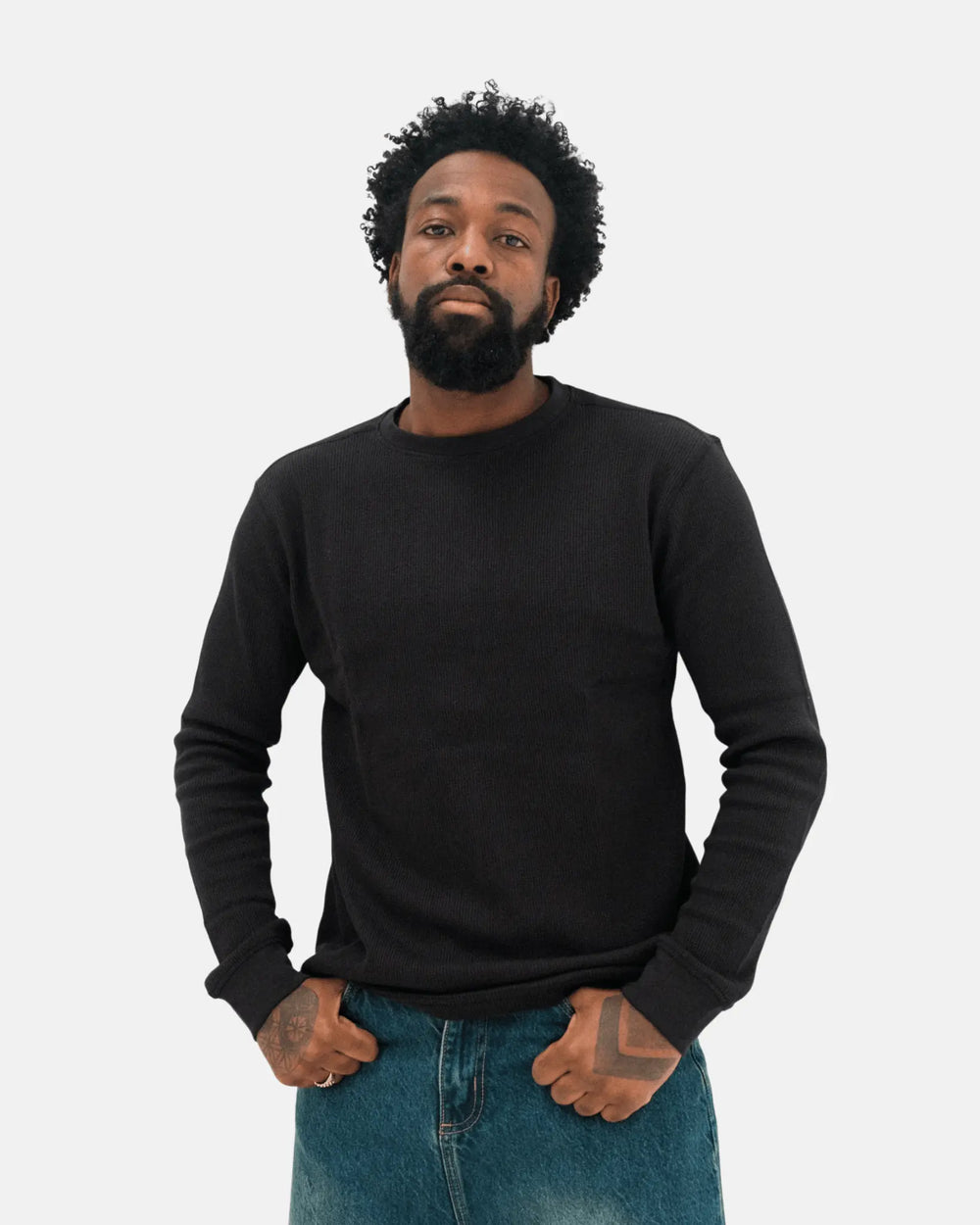 man wearing a black long sleeve t-shirt on a white background