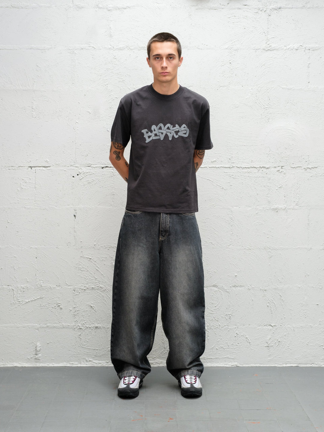 Model wearing grab tee with Denim Pant | Flint full front view