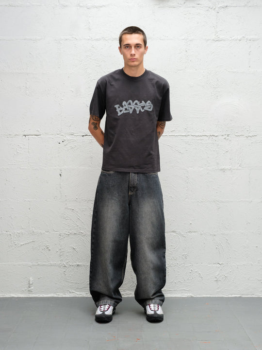 Model wearing grab tee with Denim Pant | Flint full front view
