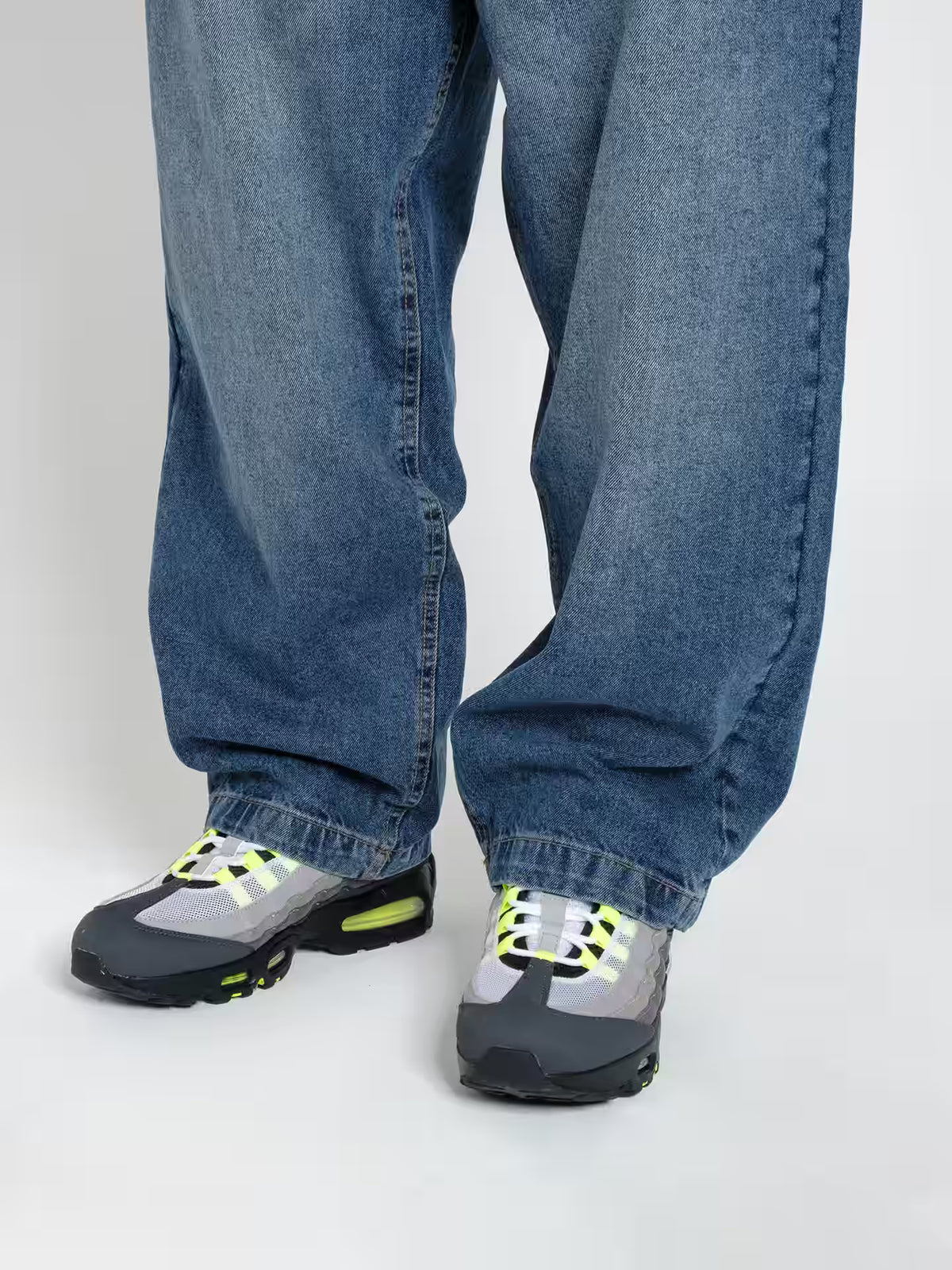 Person wearing Baggy Jeans Frost blue, showing the fit on the shoes