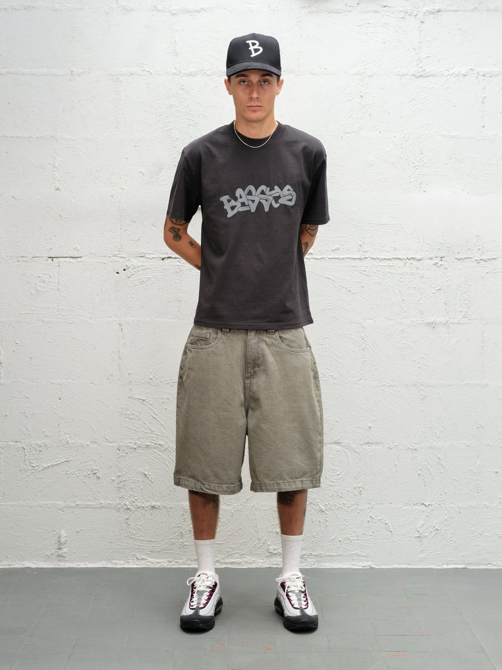 Model wearing Grab Tee faded black with Denim Short | Sage Baggys.uk front view