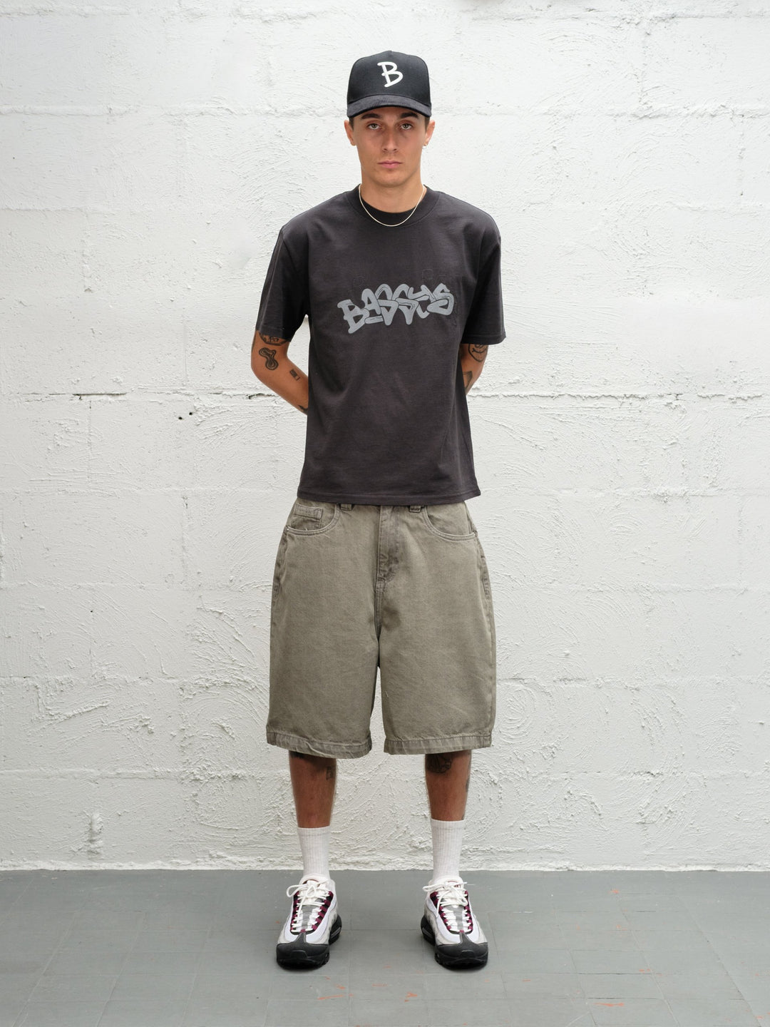 Model wearing Grab Tee faded black with Denim Short | Sage Baggys.uk front view
