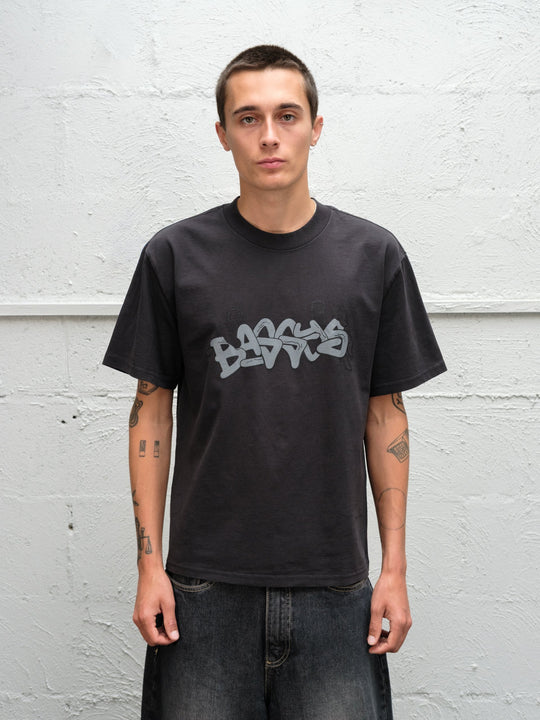 Model wearing Baggys Grab Tee in Faded Black, front view