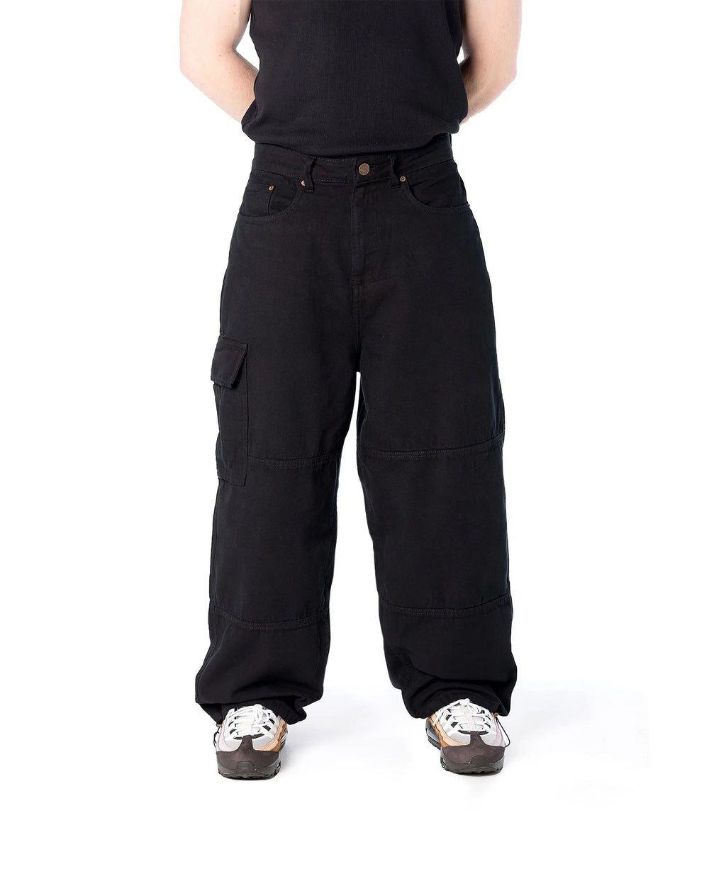 Person wearing black cargo pants on a white background