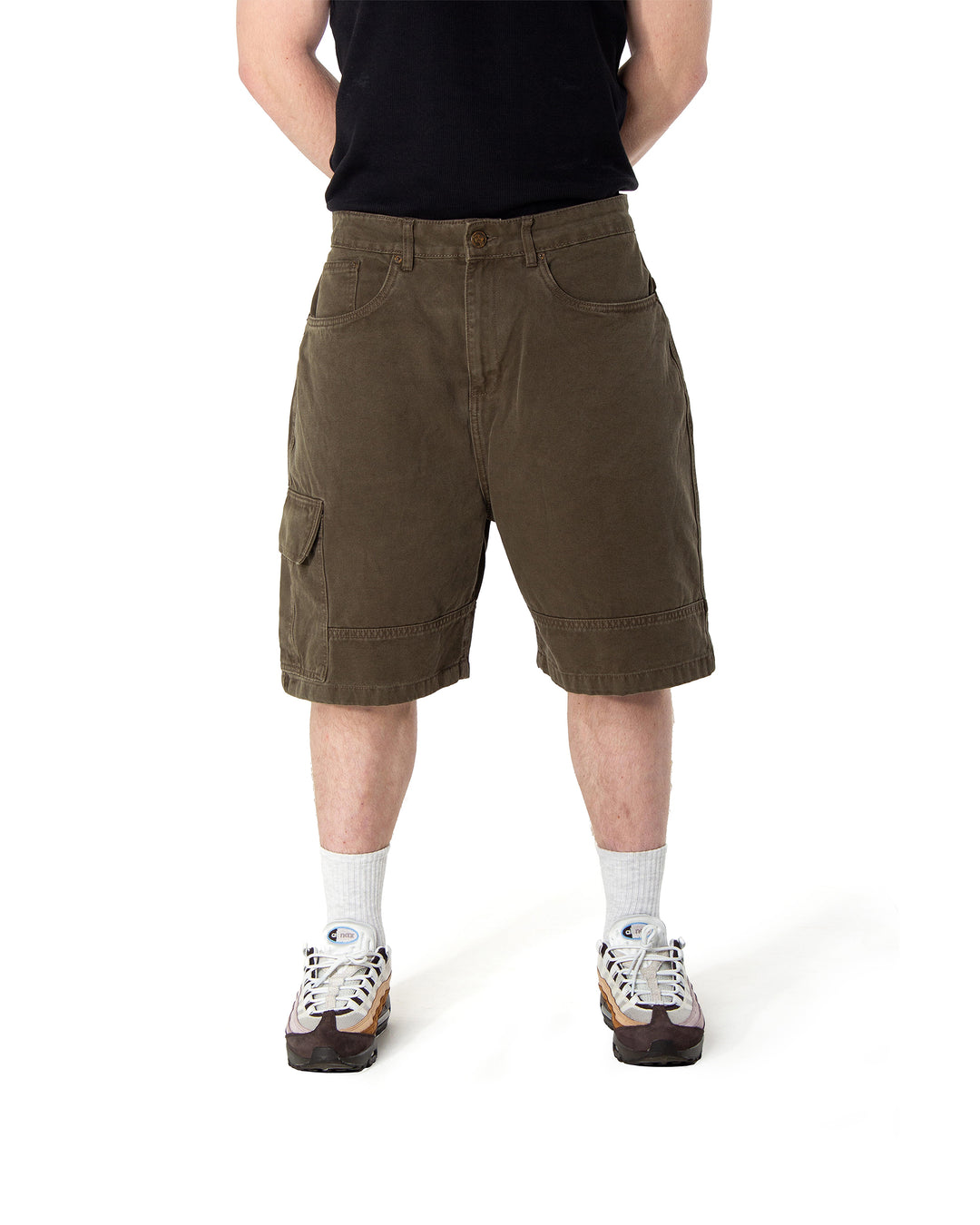 Person wearing brown shorts on a white background