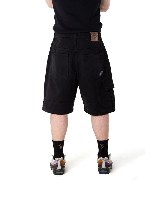 Person wearing black shorts on a white background