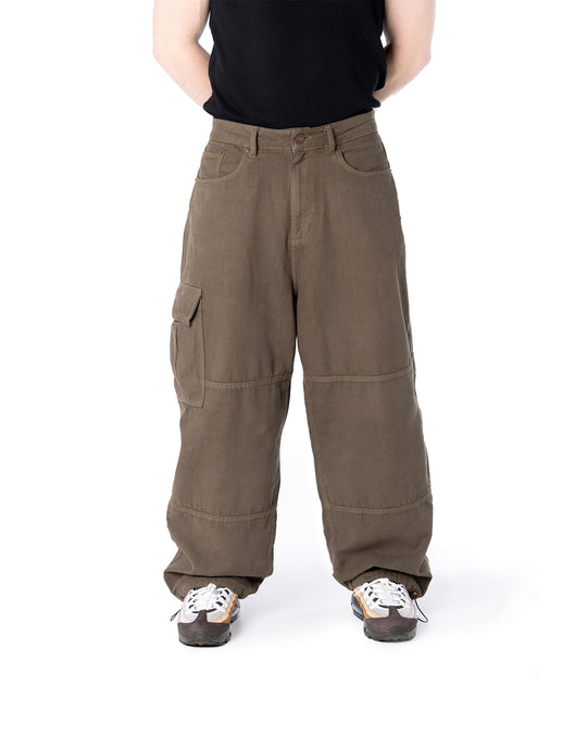 Person wearing brown cargo pants on a white background
