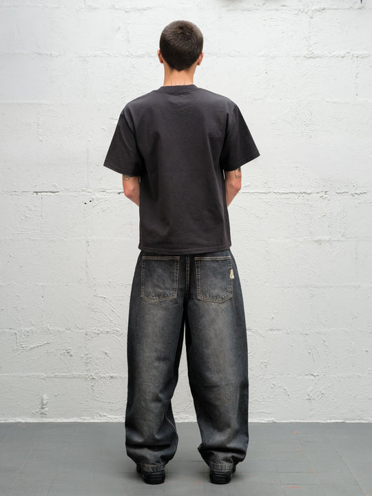 Model wearing grab tee with Denim Pant | Flint full rear view