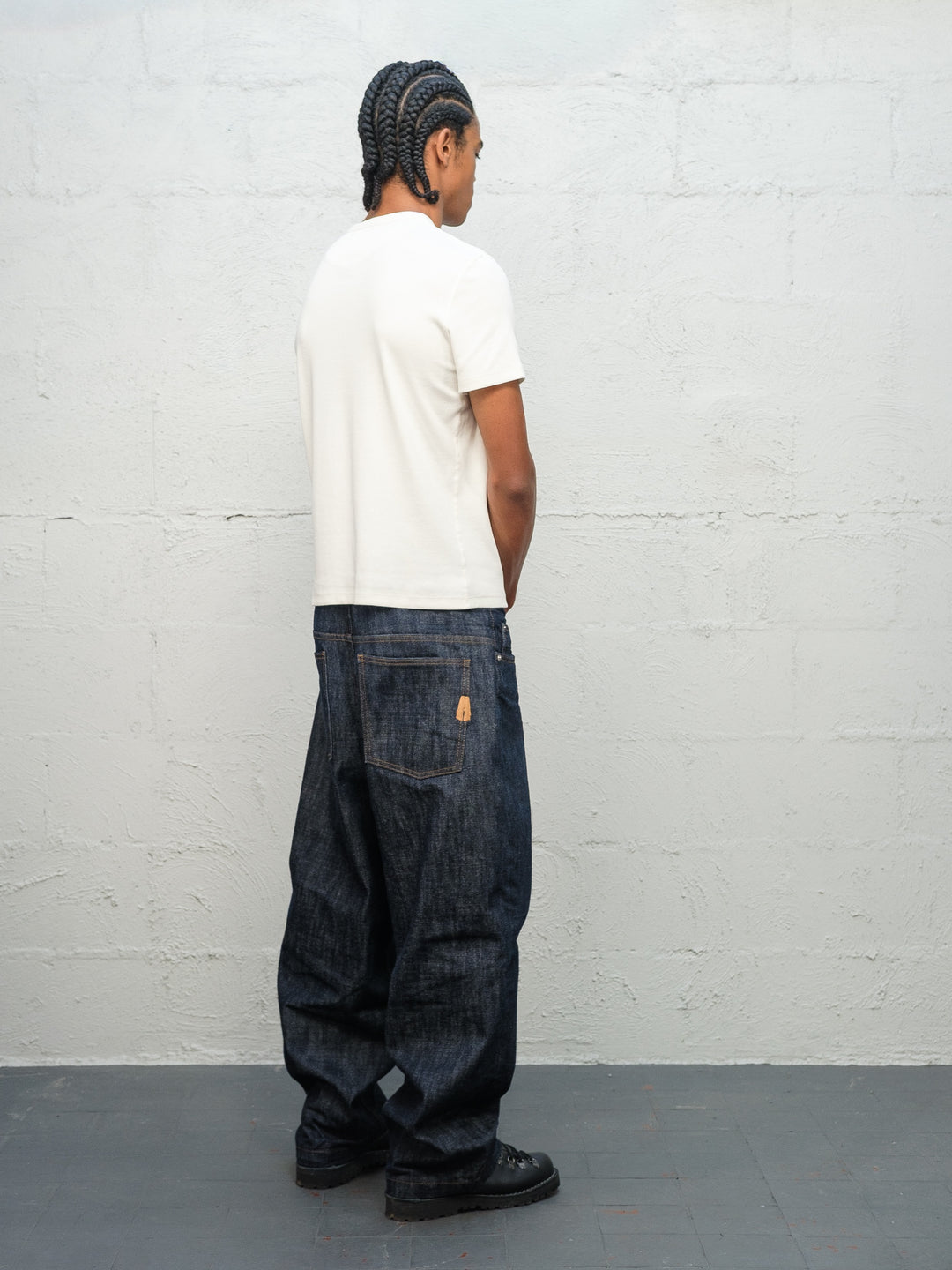 Model wearing white t-shirt and Denim Pant Indigo Selvedge Denim from rear
