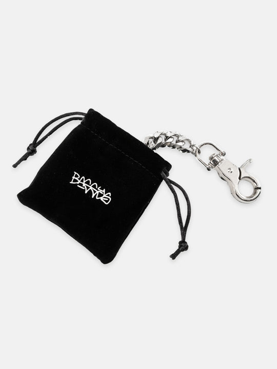 Silver wallet chain with clasp on a white background with the felt pouch 